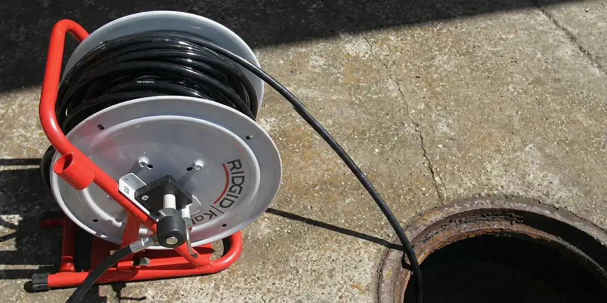 sewer rodding equipment prepared to clear clogged sewer lines in Atlanta, GA