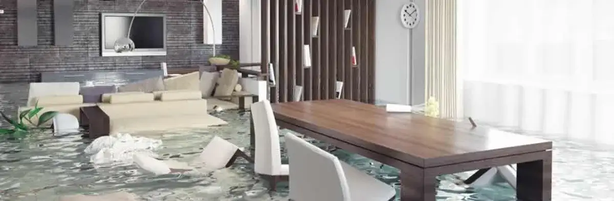 home interior affected by water damage with flooded floors and displaced furniture in Atlanta, GA